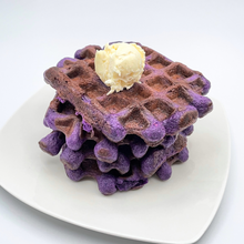 Load image into Gallery viewer, A stack of ube waffles with a scoop of butter
